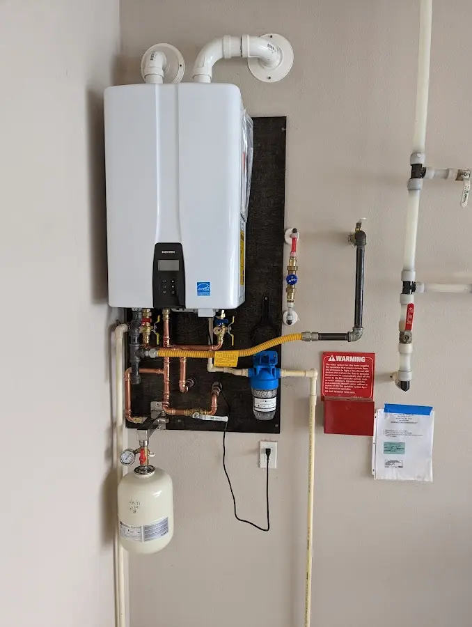 Professional plumber installing copper piping in a Annapolis home